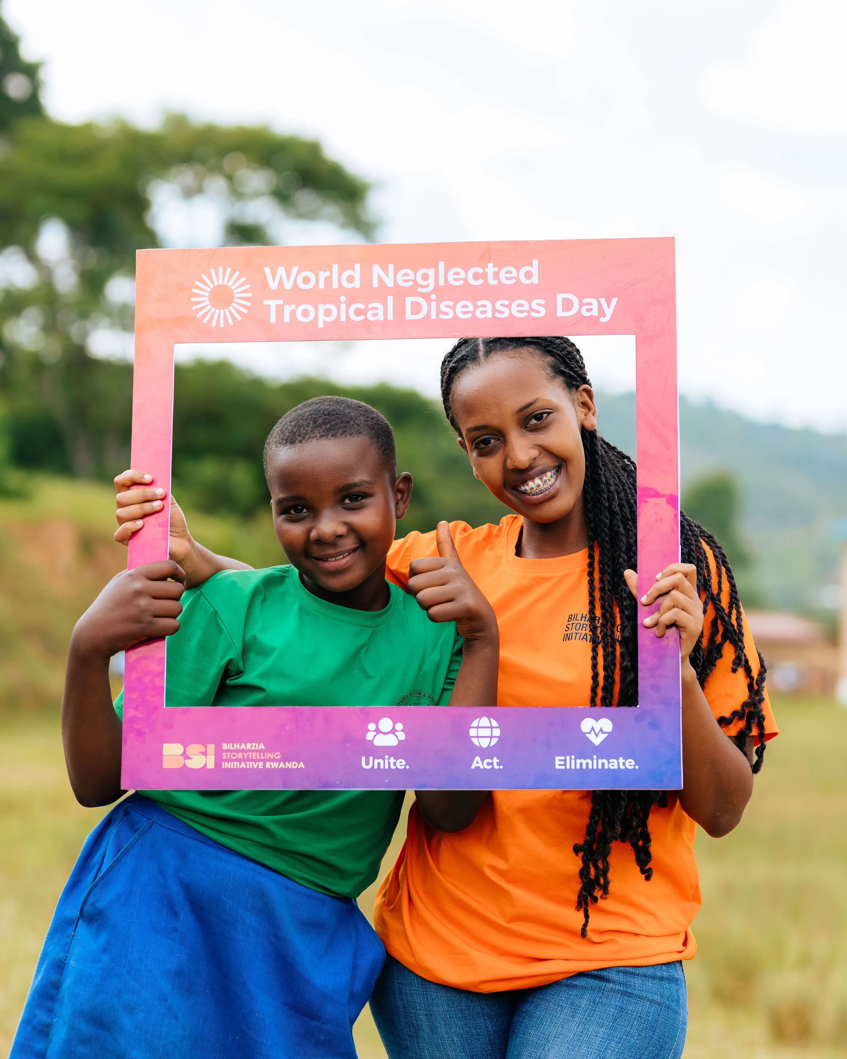 BSL Rwanda staff member with a child during community outreach